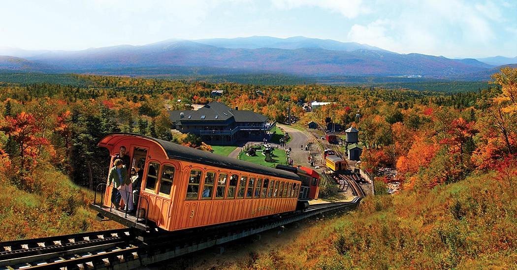 The Mount Washington Cog Railway climbing through fall foliage