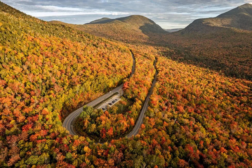 The Kancamagus Highway winding through fall color in the White Mountains