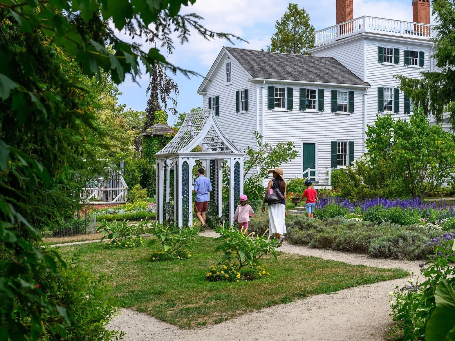 A family walking the gardens at Strawbery Banke Museum in Portsmouth