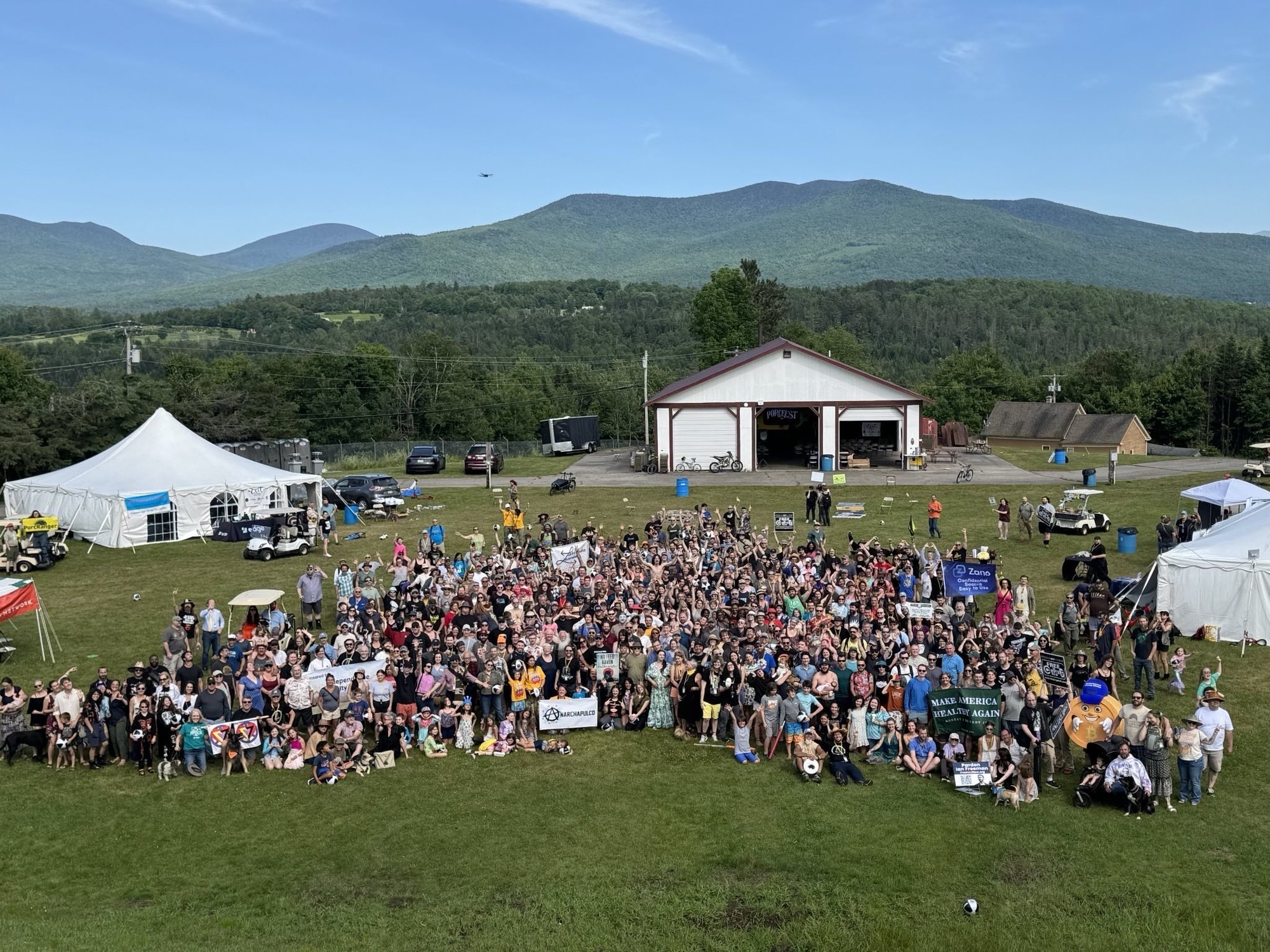 Hundreds of Free Staters gathered at PorcFest in Lancaster, New Hampshire, with the White Mountains behind them